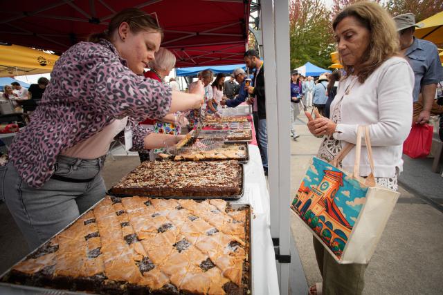 (260913) -- NORTH VANCOUVER, Sept. 13, 2026 (Xinhua) -- A woman buys traditional Polish food at the Polish Festival Vancouver in North Vancouver, British Columbia, Canada, Sept. 12, 2026. The one-day event was held here on Saturday, featuring traditional Polish cuisine, cultural performances, Polish crafts and art exhibits. (Photo by Liang Sen/Xinhua)