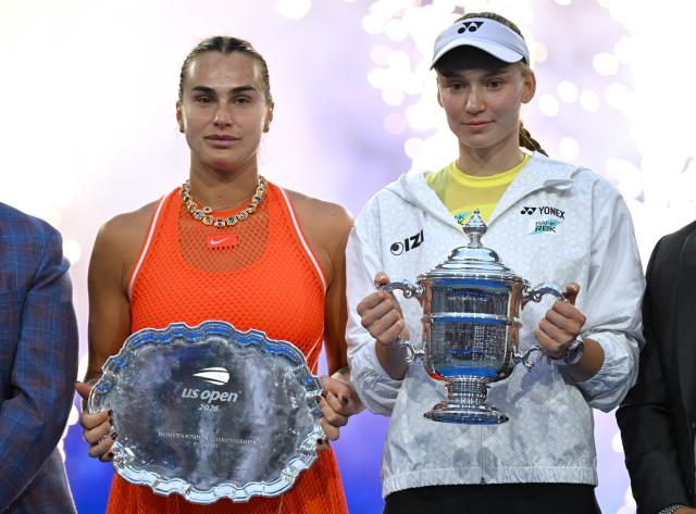 (260913) -- NEW YORK, Sept. 13, 2026 (Xinhua) -- Elena Rybakina (R)  and Aryna Sabalenka react during the awarding ceremony for the women's singles final match between Aryna Sabalenka of Belarus and Elena Rybakina of Kazakhstan at the 2026 US Open tennis championships in New York, the United States, Sept. 12, 2026. (Xinhua/Li Rui)