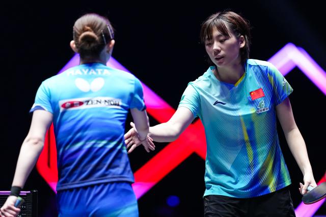 (260913) -- MACAO, Sept. 13, 2026 (Xinhua) -- Chen Yi (R) of China and Hayata Hina of Japan shake hands after their women's singles semifinal match at the 2026 World Table Tennis (WTT) Champions Macao in Macao, south China, Sept. 13, 2026. (Xinhua/Cheong Kam Ka)