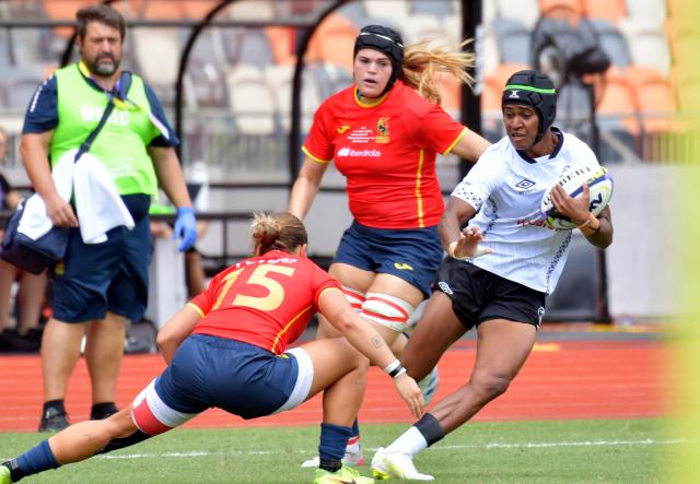 (260913) -- HONG KONG, Sept. 13, 2026 (Xinhua) -- Atelaite Buna Ralivanawa (R) of Fiji competes during the pool match between Spain and Fiji of WXV Global Series rugby competition in Hong Kong, south China, Sept. 13, 2026. (Xinhua/Lo Ping Fai)