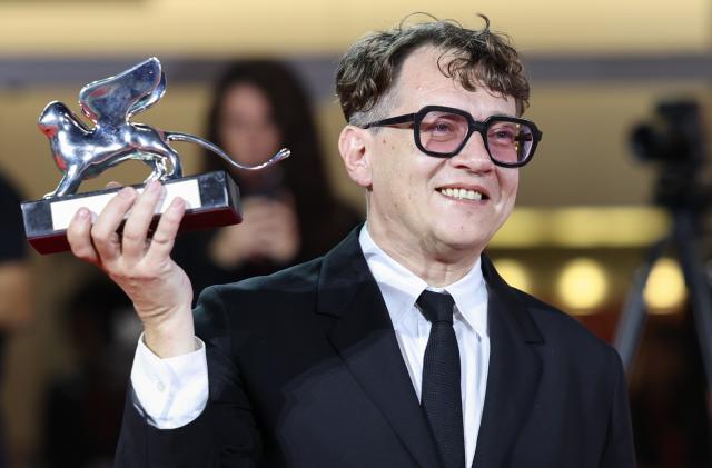 (260913) -- VENICE, Sept. 13, 2026 (Xinhua) -- Director Ilya Khrzhanovsky of the film DAU poses with the trophy of the Best Director award at the 83rd Venice International Film Festival in Venice, Italy, Sept. 12, 2026. The 83rd Venice International Film Festival closed on Saturday on Venice's Lido. (Xinhua/Wang Kaiyan)