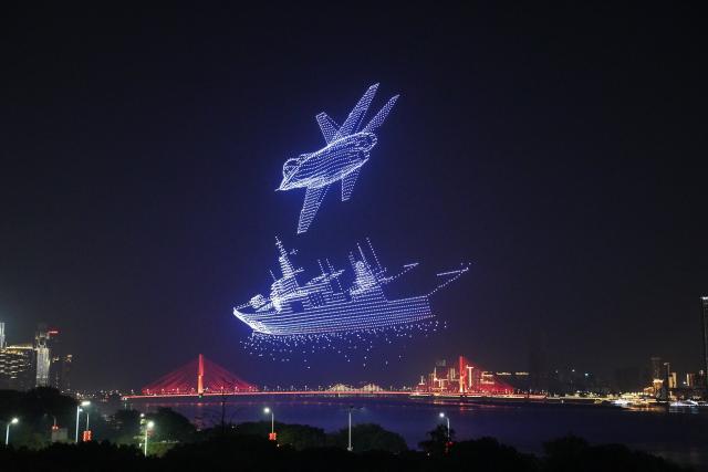 (260913) -- NANCHANG, Sept. 13, 2026 (Xinhua) -- A drone show is staged over a square along Ganjiang River in Nanchang, east China's Jiangxi Province, Sept. 12, 2026. (Xinhua/Zhou Mi)