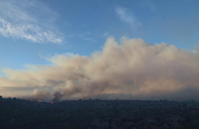 (260913) -- ZAGREB, Sept. 13, 2026 (Xinhua) -- Smoke rises over a wildfire near the town of Milna on the island of Brac, Croatia, on Sept. 12, 2026. A large wildfire burning on the Croatian island of Brac for days has spread toward villages and tourist facilities overnight, prompting the evacuation of more than 200 people, local media reported Sunday. (Ivo Cagalj/PIXSELL via Xinhua)