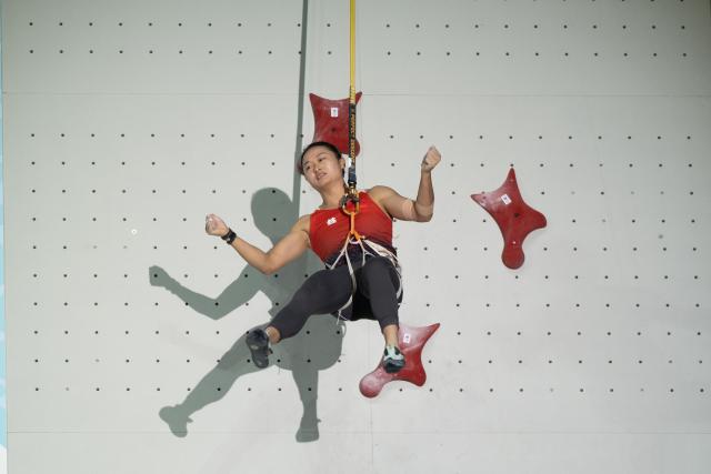 (260913) -- GUIYANG, Sept. 13, 2026 (Xinhua) -- Zhang Shaoqin of China celebrates after the women's speed relay at the World Climbing Series Guiyang 2026 in Guiyang, southwest China's Guizhou Province, Sept. 13, 2026. (Photo by Long Jianrui/Xinhua)
