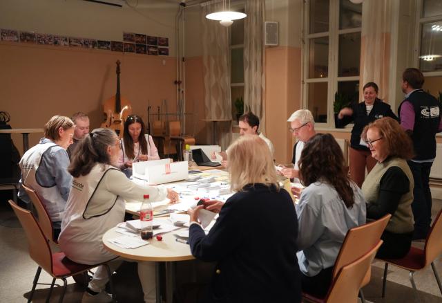 (260914) -- STOCKHOLM, Sept. 14, 2026 (Xinhua) -- Staff members count ballots at a counting station in Stockholm, Sweden, Sept. 13, 2026. Polling stations opened across Sweden on Sunday morning in a closely watched parliamentary election that could see the far-right Sweden Democrats (SD) enter government for the first time or the center-left return to power after four years in opposition.
   The opposition bloc held a lead over the right-wing bloc in two exit polls released after voting ended in Sunday's parliamentary election.
   Public broadcaster SVT's exit poll put the four opposition parties at 51.3 percent of the vote, against 46.8 percent for the four right-wing parties. A separate election-day survey by TV4 showed a similar picture, giving the opposition 51.3 percent and the right 47.0 percent. (Xinhua/Weng Xinyang)