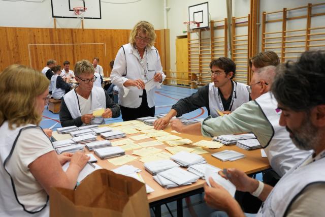 (260914) -- STOCKHOLM, Sept. 14, 2026 (Xinhua) -- Staff members count ballots at a counting station in Stockholm, Sweden, Sept. 13, 2026. Polling stations opened across Sweden on Sunday morning in a closely watched parliamentary election that could see the far-right Sweden Democrats (SD) enter government for the first time or the center-left return to power after four years in opposition.
   The opposition bloc held a lead over the right-wing bloc in two exit polls released after voting ended in Sunday's parliamentary election.
   Public broadcaster SVT's exit poll put the four opposition parties at 51.3 percent of the vote, against 46.8 percent for the four right-wing parties. A separate election-day survey by TV4 showed a similar picture, giving the opposition 51.3 percent and the right 47.0 percent. (Xinhua/Weng Xinyang)