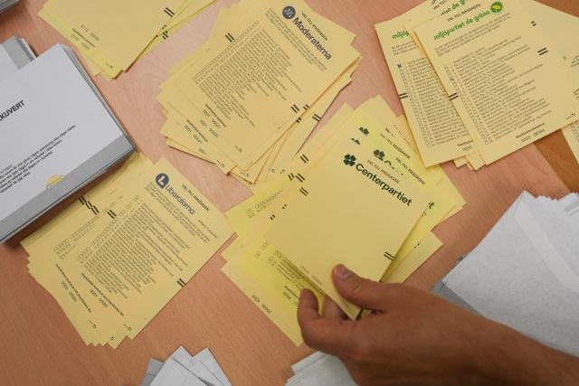 (260914) -- STOCKHOLM, Sept. 14, 2026 (Xinhua) -- A staff member works at a counting station in Stockholm, Sweden, Sept. 13, 2026. Polling stations opened across Sweden on Sunday morning in a closely watched parliamentary election that could see the far-right Sweden Democrats (SD) enter government for the first time or the center-left return to power after four years in opposition.
   The opposition bloc held a lead over the right-wing bloc in two exit polls released after voting ended in Sunday's parliamentary election.
   Public broadcaster SVT's exit poll put the four opposition parties at 51.3 percent of the vote, against 46.8 percent for the four right-wing parties. A separate election-day survey by TV4 showed a similar picture, giving the opposition 51.3 percent and the right 47.0 percent. (Xinhua/Weng Xinyang)