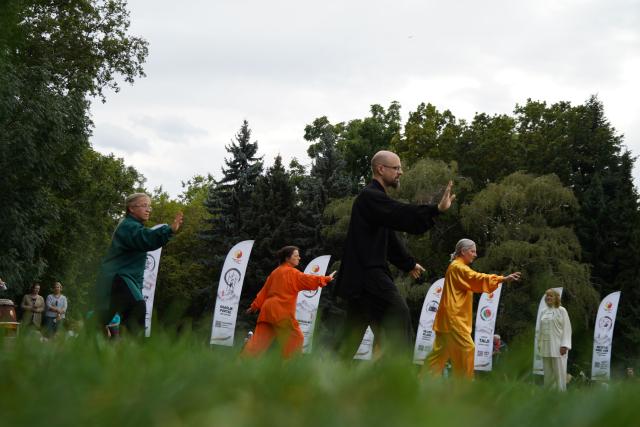 (260914) -- BUDAPEST, Sept. 14, 2026 (Xinhua) -- People perform Taiji during the 6th Family and Friends Gathering of the Hungarian Chan Wu Federation on Margaret Island in Budapest, Hungary, Sept. 13, 2026. (Xinhua/Chen Hao)