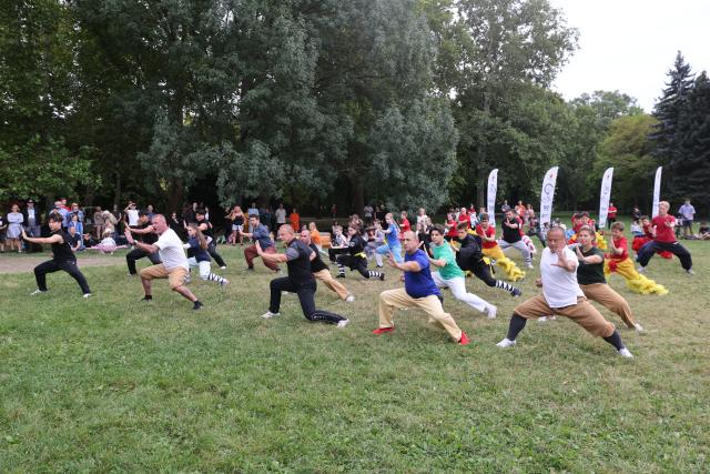 (260914) -- BUDAPEST, Sept. 14, 2026 (Xinhua) -- People practice Wushu during the 6th Family and Friends Gathering of the Hungarian Chan Wu Federation on Margaret Island in Budapest, Hungary, Sept. 13, 2026. (Photo by Attila Volgyi/Xinhua)