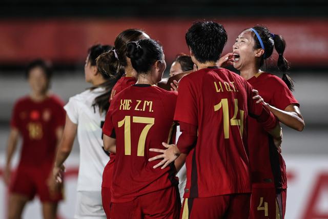 (260914) -- GIFU, Sept. 14, 2026 (Xinhua) -- Si Yu (1st R) of China celebrates her goal during the group G match of Women's Football between China and China's Hong Kong at 20th Asian Games Aichi-Nagoya 2026 in Gifu, Japan, Sept. 14, 2026. (Xinhua/Jia Haocheng)
