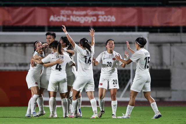 (260914) -- GIFU, Sept. 14, 2026 (Xinhua) -- Cheung Wai Ki (2nd L) of China's Hong Kong celebrates her goal during the group G match of Women's Football between China and China's Hong Kong at 20th Asian Games Aichi-Nagoya 2026 in Gifu, Japan, Sept. 14, 2026. (Xinhua/Jia Haocheng)