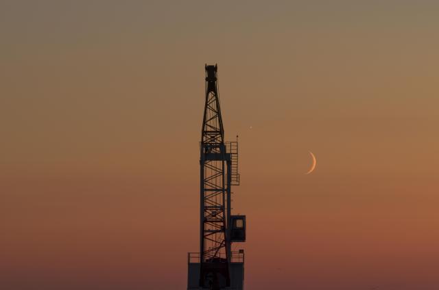 (260914) -- HARBIN, Sept. 14, 2026 (Xinhua) -- An aerial drone photo taken on Sept. 14, 2026 shows the planet of Venus next to the moon in the sky over Tongjiang City, northeast China's Heilongjiang Province. (Photo by Li Wenbin/Xinhua)