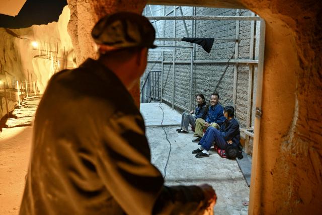 (260914) -- YINCHUAN, Sept. 14, 2026 (Xinhua) -- Farmer-actor Wang Guozhong (L) chats with fellow actors waiting backstage at the "theater village" in Minning Town of Yinchuan, northwest China's Ningxia Hui Autonomous Region, Sept. 11, 2026.
  This year marks the 30th anniversary of paired assistance initiative between southeast China's Fujian Province and northwest China's Ningxia Hui Autonomous Region for targeted poverty alleviation.
   A new "theater village" cultural tourism project has been launched in Minning Town of Yinchuan to commemorate the past three decades of Fujian-Ningxia cooperation. A total of 36 original plays recount the continuous efforts of anti-poverty by Ningxia with help from Fujian over the past 30 years.
   Since the project opened in July this year, it has helped 2,500 local residents nearby secure jobs and increase their incomes. (Xinhua/Yang Zhisen)