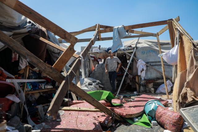 (260914) -- GAZA, Sept. 14, 2026 (Xinhua) -- Palestinians inspect a damaged tent after it was targeted by a missile fired from an Israeli drone in the al-Rimal neighborhood in central Gaza, on Sept. 14, 2026. (Photo by Rizek Abdeljawad/Xinhua)