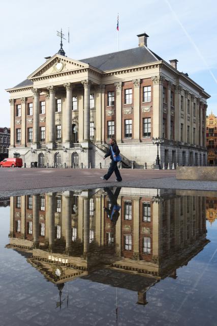 (260914) -- GRONINGEN, Sept. 14, 2026 (Xinhua) -- A woman walks by the city hall of Groningen, the Netherlands, Sept. 14, 2026. Groningen, the capital of the Dutch province of Groningen, is a historic city in the north of the Netherlands. (Xinhua/Shao Haijun)