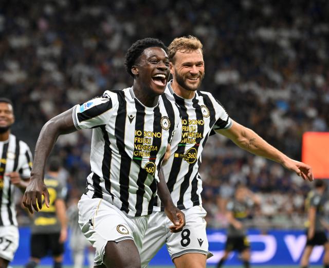 (260915) -- MILAN, Sept. 15, 2026 (Xinhua) -- Udinese's James Abankwah (L) celebrates his goal during a Serie A soccer match between Inter Milan and Udinese in Milan, Italy, Sept.14, 2026. (Photo by Alberto Lingria/Xinhua)