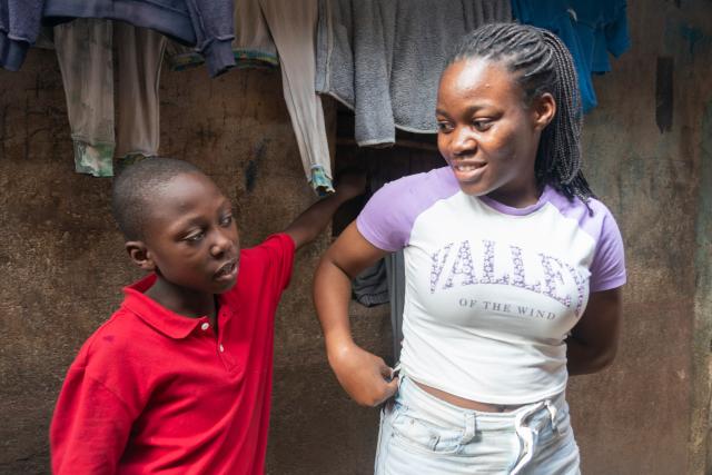 (260915) -- NAIROBI, Sept. 15, 2026 (Xinhua) -- Miriam Achieng Kenyatta (R) communicates with her brother at Kibera informal settlement in Nairobi, Kenya, Sept. 5, 2026. Miriam Achieng Kenyatta, a 23-year-old geospatial engineering student at the University of Nairobi, received a warm reception upon returning home after making history at the 25th "Chinese Bridge" Chinese Proficiency Competition for Foreign College Students.
  Raised in Nairobi's Kibera informal settlement, Achieng's life trajectory was transformed by a childhood curiosity sparked by a television movie. Her passion culminated in the highest-ever ranking by a Kenyan in the prestigious global contest, where she placed among the Top 15 worldwide.
  TO GO WITH "From Kibera to world top 15: Kenyan student makes history in Chinese competition" (Xinhua/Xie Jianfei)