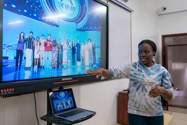 (260915) -- NAIROBI, Sept. 15, 2026 (Xinhua) -- Miriam Achieng Kenyatta shares her experience on participating in the global finals of the 25th "Chinese Bridge" Chinese Proficiency Competition for Foreign College Students in China during a Chinese class at the Confucius Institute at the University of Nairobi in Nairobi, Kenya, Sept. 8, 2026. Miriam Achieng Kenyatta, a 23-year-old geospatial engineering student at the University of Nairobi, received a warm reception upon returning home after making history at the 25th "Chinese Bridge" Chinese Proficiency Competition for Foreign College Students.
  Raised in Nairobi's Kibera informal settlement, Achieng's life trajectory was transformed by a childhood curiosity sparked by a television movie. Her passion culminated in the highest-ever ranking by a Kenyan in the prestigious global contest, where she placed among the Top 15 worldwide.
  TO GO WITH "From Kibera to world top 15: Kenyan student makes history in Chinese competition" (Xinhua/Xie Jianfei)