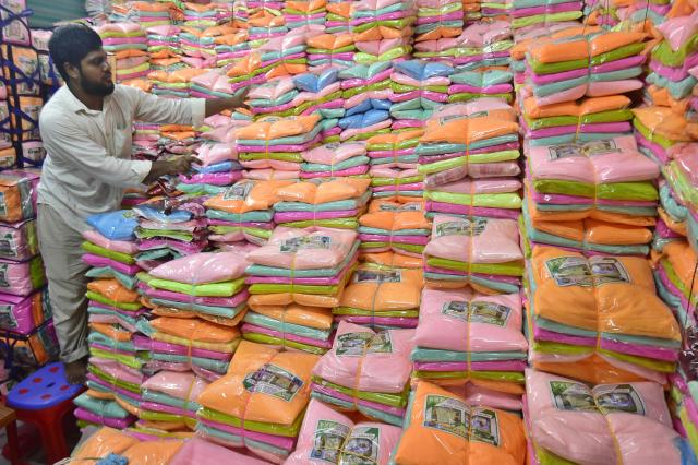 (260915) -- NARAYANGANJ, Sept. 15, 2026 (Xinhua) -- A seller works at a wholesale market for mosquito nets in Narayanganj, Bangladesh, on Sept. 14, 2026. Bangladesh has seen a rising demand for mosquito nets and other protective products amid an ongoing dengue outbreak. (Photo by Habibur Rahman/Xinhua)