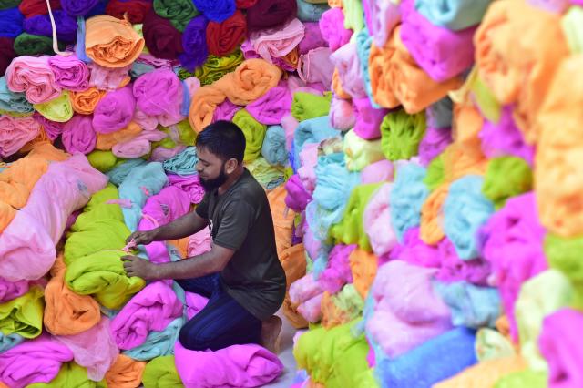 (260915) -- NARAYANGANJ, Sept. 15, 2026 (Xinhua) -- A seller works at a wholesale market for mosquito nets in Narayanganj, Bangladesh, on Sept. 14, 2026. Bangladesh has seen a rising demand for mosquito nets and other protective products amid an ongoing dengue outbreak. (Photo by Habibur Rahman/Xinhua)