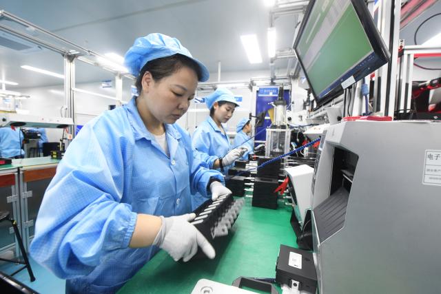 (260916) -- BEIJING, Sept. 16, 2026 (Xinhua) -- Employees work on products for export orders at an automotive electronics company in Xinle City of Shijiazhuang, north China's Hebei Province, Sept. 15, 2026. China's economy maintained steady momentum boosted by innovation-led and high-quality development in August, with production and supply growing steadily, employment and prices generally stable, and foreign trade registering rapid growth, official data showed on Tuesday. (Photo by Jia Minjie/Xinhua)