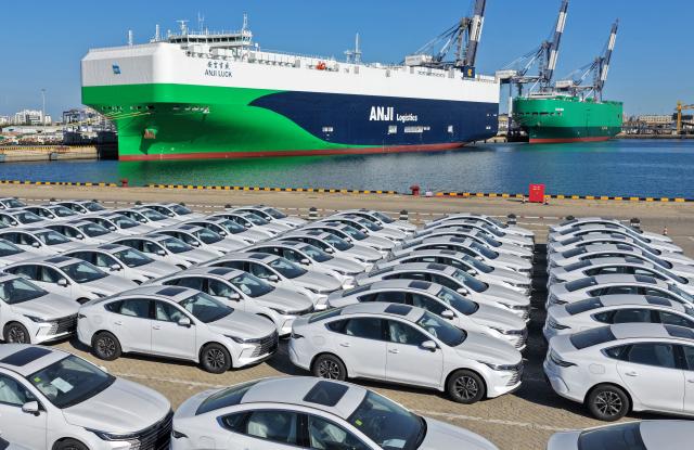 (260916) -- BEIJING, Sept. 16, 2026 (Xinhua) -- A drone photo shows new energy vehicles to be exported at Yantai Port in east China's Shandong Province, Sept. 15, 2026. China's economy maintained steady momentum boosted by innovation-led and high-quality development in August, with production and supply growing steadily, employment and prices generally stable, and foreign trade registering rapid growth, official data showed on Tuesday. (Photo by Tang Ke/Xinhua)