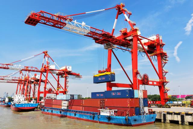 (260916) -- BEIJING, Sept. 16, 2026 (Xinhua) -- A drone photo shows a cargo ship docking at Yangzhou Port to unload containers in Yangzhou, east China's Jiangsu Province, Sept. 15, 2026. China's economy maintained steady momentum boosted by innovation-led and high-quality development in August, with production and supply growing steadily, employment and prices generally stable, and foreign trade registering rapid growth, official data showed on Tuesday. (Photo by Meng Delong/Xinhua)