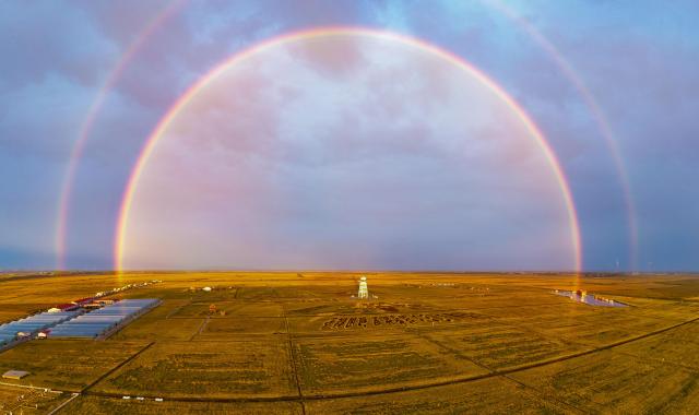 (260916) -- BEIJING, Sept. 16, 2026 (Xinhua) -- A stitched aerial drone photo taken on Sept. 13, 2026 shows rainbows over paddy fields in Fujin City, northeast China's Heilongjiang Province. Heilongjiang is embracing the ripening season of paddy rice. (Photo by Qu Yubao/Xinhua)