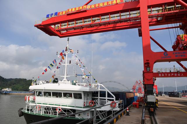 (260916) -- NANNING, Sept. 16, 2026 (Xinhua) -- A cargo vessel prepares to depart for Yangpu Port in south China's Hainan Province along the Pinglu Canal at an operation area in Nanning Port, south China's Guangxi Zhuang Autonomous Region, Sept. 16, 2026. China opened a major new canal on Wednesday, giving its landlocked southwest a shortcut to the coast and overseas markets, particularly those in the Association of Southeast Asian Nations (ASEAN), the country's largest trading partner.
   Built at a cost of 72.7 billion yuan (about 10.75 billion U.S. dollars), the 134.2-kilometer Pinglu Canal runs from Nanning, capital of south China's Guangxi Zhuang Autonomous Region, to the Beibu Gulf, the closest maritime outlet for much of southwest China. (Xinhua/Cao Yiming)