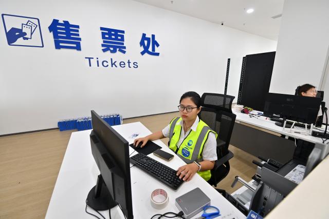 (260916) -- NANNING, Sept. 16, 2026 (Xinhua) -- Staff members work at the ticketing office at Qinzhou service area along the Pinglu Canal in Qinzhou, south China's Guangxi Zhuang Autonomous Region, Sept. 16, 2026. China opened the Pinglu Canal on Wednesday, giving its landlocked southwest a shortcut to the coast and overseas markets, particularly those in the Association of Southeast Asian Nations (ASEAN), the country's largest trading partner.
   Built at a cost of 72.7 billion yuan (about 10.75 billion U.S. dollars), the 134.2-kilometer canal runs from Hengzhou, a county-level city in south China's Guangxi Zhuang Autonomous Region, to the Beibu Gulf, the closest maritime outlet for much of southwest China. (Xinhua/Lu Boan)