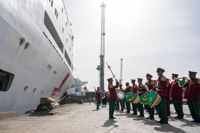 (260916) -- NOUAKCHOTT, Sept. 16, 2026 (Xinhua) -- The Chinese People's Liberation Army Navy hospital ship Auspicious Ark is welcomed by Mauritanian military band after arriving at the Friendship Port in Nouakchott, the capital of Mauritania, Sept. 15, 2026. The hospital ship arrived in Mauritania on Tuesday for a seven-day friendly visit, during which it would provide medical services.
  TO GO WITH "Chinese navy hospital ship arrives in Mauritania for medical mission" (Xinhua/Xie Jianfei)