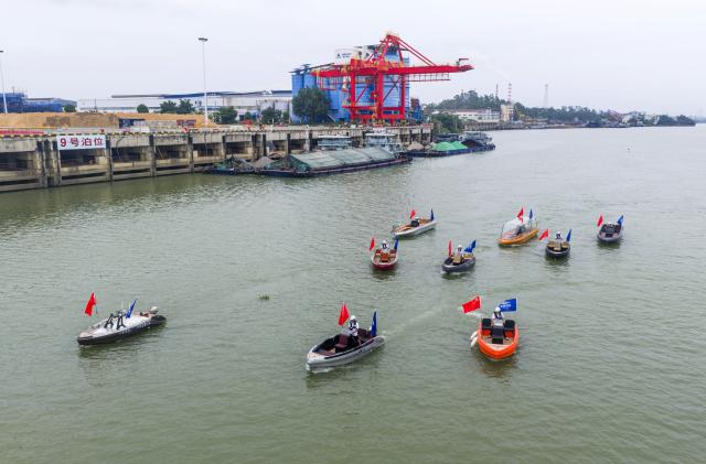 (260916) -- NANNING, Sept. 16, 2026 (Xinhua) -- A drone photo taken on June 19, 2026 shows new-energy ships sailing at Nanning Port, south China's Guangxi Zhuang Autonomous Region. (Photo by Liu Zheng/Xinhua)