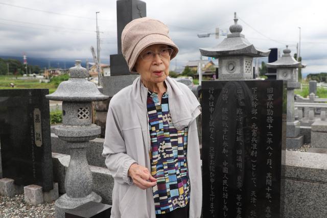 (260916) -- TOKYO, Sept. 16, 2026 (Xinhua) -- Ayako Kurahashi receives an interview with Xinhua in front of a monument bearing her father's apology at a cemetery in Yoshioka, Gunma Prefecture, Japan, on Sept. 7, 2026. TO GO WITH "Feature: A father's wish, a daughter's mission to apologize for Japan's war against China" (Xinhua/Chen Zean)