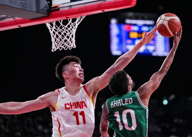 (260916) -- NAGOYA, Sept. 16, 2026 (Xinhua) -- Yu Jiahao (L) of China blocks Khaled Abdelgabar of Saudi Arabia during the quarterfinal match between China and Saudi Arabia at 20th Asian Games Aichi-Nagoya 2026 in Nagoya, Japan, Sept. 16, 2026. (Xinhua/Luo Yuan)