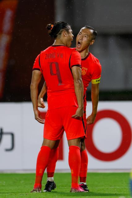 (260916) -- NAGOYA, Sept. 16, 2026 (Xinhua) -- Zhang Yuning (L) of China celebrates his goal with teammate Wu Xi during the group B match of men's football between China and the Democratic People's Republic of Korea (DPRK) at 20th Asian Games Aichi-Nagoya 2026 in Nagoya, Japan, Sept. 16, 2026. (Xinhua/Wu Zhizun)