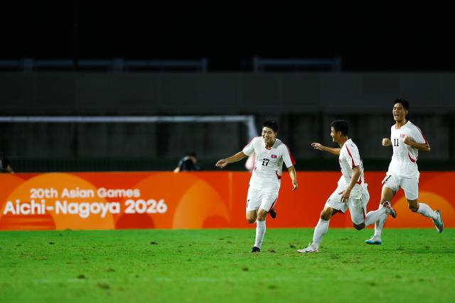 (260916) -- NAGOYA, Sept. 16, 2026 (Xinhua) -- Choe Kuk (1st L) of DPRK celebrates his goal during the group B match of men's football between China and the Democratic People's Republic of Korea (DPRK) at 20th Asian Games Aichi-Nagoya 2026 in Nagoya, Japan, Sept. 16, 2026. (Xinhua/Wu Zhizun)