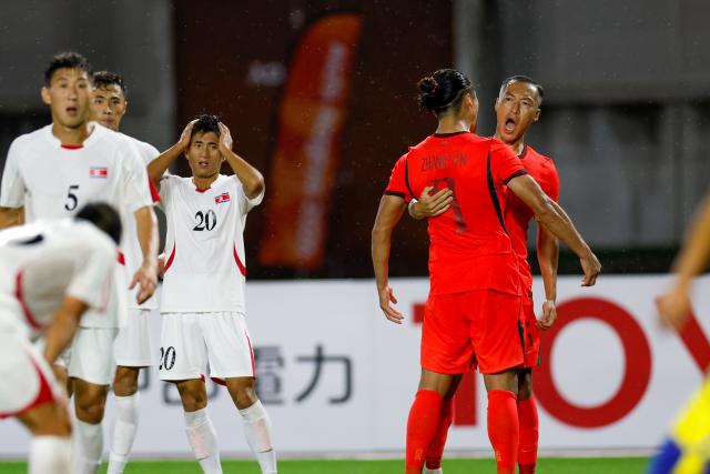 (260916) -- NAGOYA, Sept. 16, 2026 (Xinhua) -- Zhang Yuning (2nd R) of China celebrates his goal with teammate Wu Xi (1st R) during the group B match of men's football between China and the Democratic People's Republic of Korea (DPRK) at 20th Asian Games Aichi-Nagoya 2026 in Nagoya, Japan, Sept. 16, 2026. (Xinhua/Wu Zhizun)