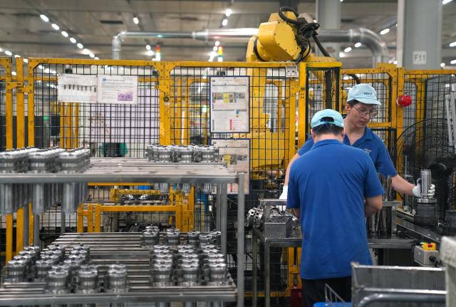 (260916) -- NANCHANG, Sept. 16, 2026 (Xinhua) -- Workers produce air conditioner compressor parts at Highly Group's production base in Nanchang, east China's Jiangxi Province, Aug. 20, 2026. Smart, digitalized production has been fully realized at the Nanchang production base of electric appliance manufacturer Highly Group, a leading intelligent manufacturing base for air conditioner compressors. On average, the base produces a compressor every 6.5 seconds. Highly Group exports air conditioner compressors to 165 countries and regions worldwide, accounting for nearly one-seventh of the global market share. (Xinhua/Wan Xiang)