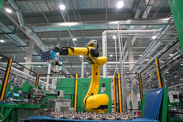 (260916) -- NANCHANG, Sept. 16, 2026 (Xinhua) -- A robotic arm is at work at Highly Group's production base in Nanchang, east China's Jiangxi Province, Aug. 20, 2026. Smart, digitalized production has been fully realized at the Nanchang production base of electric appliance manufacturer Highly Group, a leading intelligent manufacturing base for air conditioner compressors. On average, the base produces a compressor every 6.5 seconds. Highly Group exports air conditioner compressors to 165 countries and regions worldwide, accounting for nearly one-seventh of the global market share. (Xinhua/Wan Xiang)