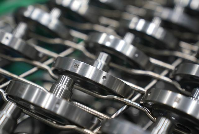 (260916) -- NANCHANG, Sept. 16, 2026 (Xinhua) -- This photo taken on Aug. 20, 2026 shows air conditioner compressor parts bearing QR codes which provide these parts' manufacturing information at Highly Group's production base in Nanchang, east China's Jiangxi Province. Smart, digitalized production has been fully realized at the Nanchang production base of electric appliance manufacturer Highly Group, a leading intelligent manufacturing base for air conditioner compressors. On average, the base produces a compressor every 6.5 seconds. Highly Group exports air conditioner compressors to 165 countries and regions worldwide, accounting for nearly one-seventh of the global market share. (Xinhua/Wan Xiang)