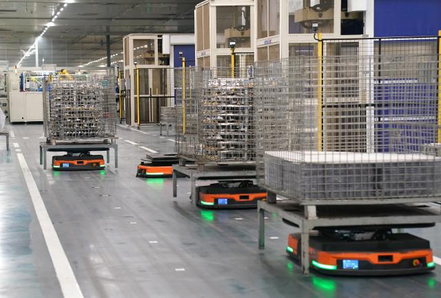 (260916) -- NANCHANG, Sept. 16, 2026 (Xinhua) -- Automated guided vehicles are at work at Highly Group's production base in Nanchang, east China's Jiangxi Province, Aug. 20, 2026. Smart, digitalized production has been fully realized at the Nanchang production base of electric appliance manufacturer Highly Group, a leading intelligent manufacturing base for air conditioner compressors. On average, the base produces a compressor every 6.5 seconds. Highly Group exports air conditioner compressors to 165 countries and regions worldwide, accounting for nearly one-seventh of the global market share. (Xinhua/Wan Xiang)