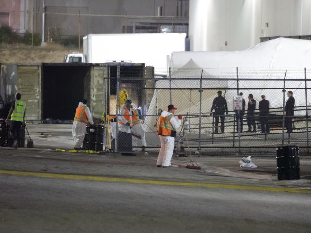 (260916) -- LOS ANGELES, Sept. 16, 2026 (Xinhua) -- Police and firefighters investigate at the site of a helicopter crash in Los Angeles, California, the United States, Sept. 16, 2026. A helicopter crashed between two commercial buildings in suburban Los Angeles on Tuesday night, killing at least three people, local authorities said. (Photo by Qiu Chen/Xinhua)