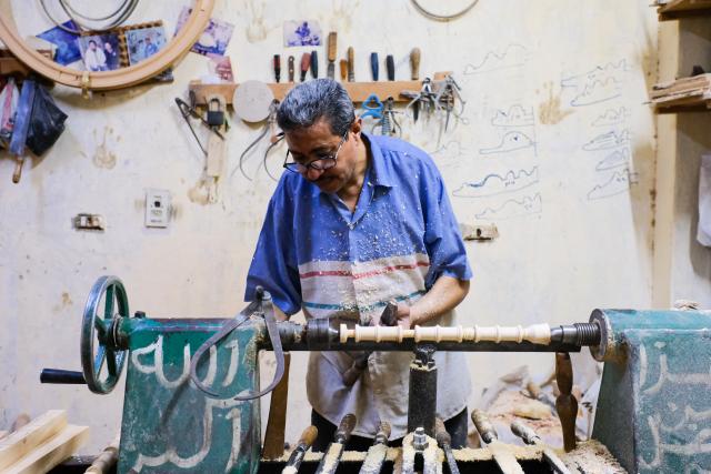 (260916) -- CAIRO, Sept. 16, 2026 (Xinhua) -- A carpenter carves a piece of wood in Cairo, Egypt, Sept. 16, 2026. (Xinhua/Xin Mengchen)