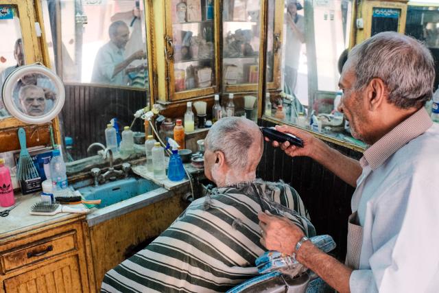 (260916) -- CAIRO, Sept. 16, 2026 (Xinhua) -- A customer gets a haircut at a barbershop in Cairo, Egypt, Sept. 16, 2026. (Xinhua/Xin Mengchen)