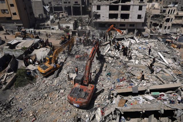 (260916) -- GAZA, Sept. 16, 2026 (Xinhua) -- Palestinian civil defense crews search for bodies and survivors in the rubble of a collapsed building that housed displaced Palestinians in Gaza City, Sept. 16, 2026. The death toll from the collapse of a residential building in western Gaza City rose to 21, including 11 children and six women, with more than 25 injured, local officials and residents said Wednesday. (Photo by Rizek Abdeljawad/Xinhua)