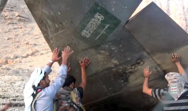 (260916) -- MARIB, Sept. 16, 2026 (Xinhua) -- This handout screenshot provided by Houthi Media Center shows Houthi fighters inspecting the downed Saudi fighter jet in Marib province, Yemen, Sept. 16, 2026. Yemen's Houthi group said Wednesday that it had shot down a Saudi F-15 fighter jet over the northeastern province of Marib, as hostilities between the two sides entered a new phase of intensified air operations and cross-border attacks. (Houthi Media Center/Handout via Xinhua)