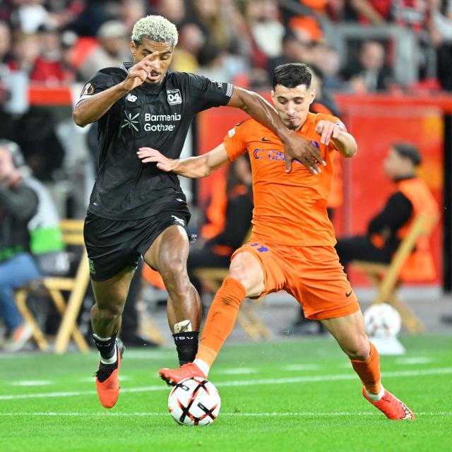 (260917) -- LEVERKUSEN, Sept. 17, 2026 (Xinhua) -- Loic Bade (L) of Bayer 04 Leverkusen vies with Milot Avdyli of NK Celje during the UEFA Europa League football match between Bayer 04 Leverkusen and NK Celje in Leverkusen, Germany, Sept. 16, 2026. (Photo by Ulrich Hufnagel/Xinhua)