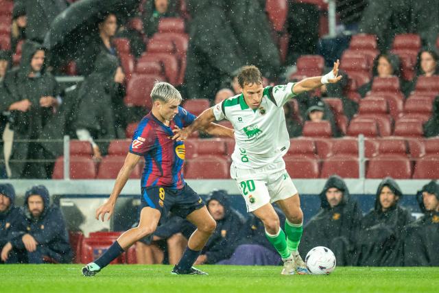 (260917) -- BARCELONA, Sept. 17, 2026 (Xinhua) -- FC Barcelona's Pedri (L) vies with Racing Santander's Sergio Canales during the La Liga football match between FC Barcelona and Racing Santander in Barcelona, Spain, on Sept. 16, 2026. (Photo by Joan Gosa/Xinhua)