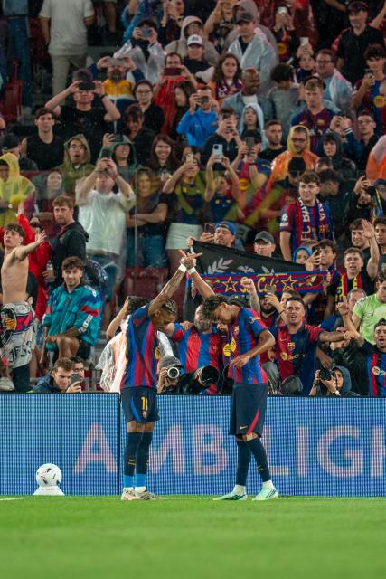 (260917) -- BARCELONA, Sept. 17, 2026 (Xinhua) -- FC Barcelona's Raphinha (L) celebrates his goal with teammate Lamine Yamal during the La Liga football match between FC Barcelona and Racing Santander in Barcelona, Spain, on Sept. 16, 2026. (Photo by Joan Gosa/Xinhua)