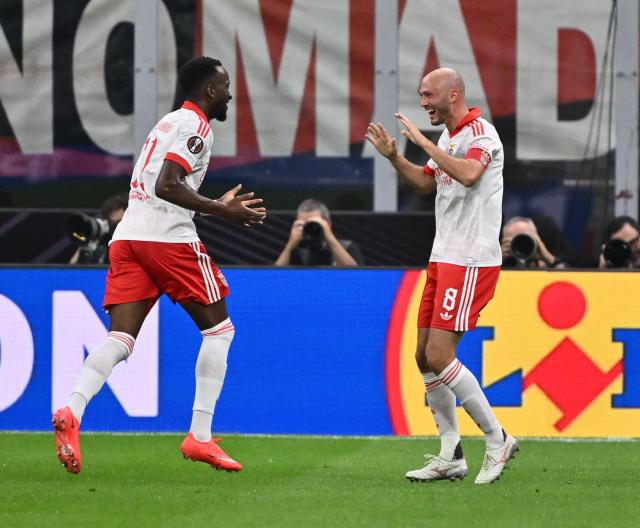 (260917) -- MILAN, Sept. 17, 2026 (Xinhua) -- Benfica's Dodi Lukebakio (L) celebrates his goal with teammate Fredrik Aursnes during the UEFA Europa League match between AC Milan and Benfica in Milan, Italy, Sept. 16, 2026. (Photo by Alberto Lingria/Xinhua)